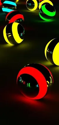 This live wallpaper exhibits a striking digital artwork consisting of glowing ball-shaped objects on a table