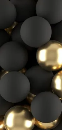 This phone live wallpaper by Emma Andijewska features sleek black and gold spheres against a reflective mirror background