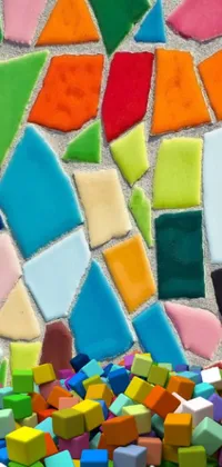 This phone live wallpaper features a colorful mosaic of blocks inspired by Gaudi with hand-glazed pottery shards and seaglass cutouts, creating a stunning cityscape