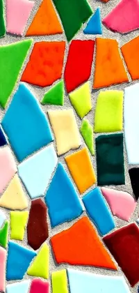 Looking for a visually stunning live wallpaper for your phone? Check out this colorful tile mosaic! Featuring hand-glazed pottery shards in a variety of hues and shades, this lively wallpaper is sure to add a pop of color and energy to your device's screen