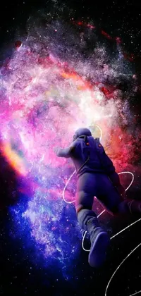 This live wallpaper features a man in a space suit flying through a red and purple nebula set against a background of NASA footage