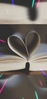 Looking for an adorable live wallpaper for your phone? Introducing a charming book-themed live wallpaper with a heart-shaped cut-out on the cover