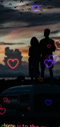 This visually stunning live wallpaper captures a couple standing atop a van against a moody 3 am backdrop