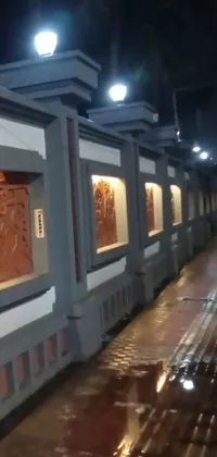 This amazing live wallpaper for your phone shows a stunning street art display on a rainy evening