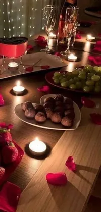 This stunning phone live wallpaper showcases a decadent wooden table adorned with plates of mouth-watering chocolate and glistening candles, exuding an ambiance of romance and luxury