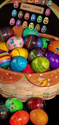 This lively phone wallpaper features a basket brimming with colorful Easter eggs