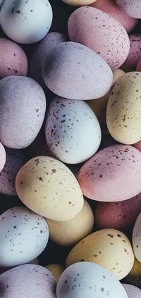 Adorn your phone's home screen with a delightful live wallpaper of speckled candy-colored eggs, adorably stacked on top of each other