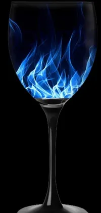 This live wallpaper features a glass filled with blue smoke on a black background