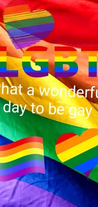 Celebrate the LGBTQ+ community with this live phone wallpaper featuring a vibrant rainbow flag and the words "lgbt what a wonderful day to be gay"