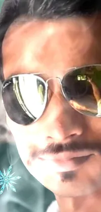 This live phone wallpaper depicts a close-up of someone stylish, wearing sunglasses