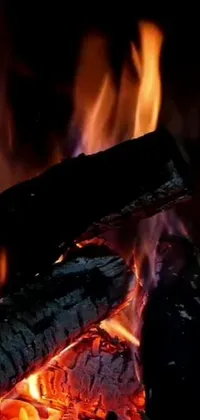 Looking for the perfect live wallpaper that'll bring life to your mobile device? Look no further! Our phone live wallpaper features a cozy close up of a fiery fireplace with glowing embers, and flickering flames to add a warm and welcoming feel to your screen