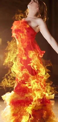 This phone live wallpaper showcases a mesmerizing image of a woman dressed in fiery red complemented by a stage background