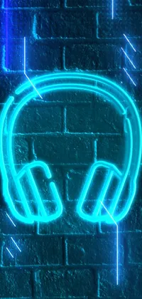 Looking for a stunning live wallpaper for your phone? Check out this neon sign of headphones on a brick wall! Made using high-quality images from Pexels, this wallpaper will make your phone stand out with its vibrant cyan color scheme and professional avatar image