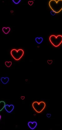 This stunning live wallpaper for phones showcases a plethora of neon hearts on a black background