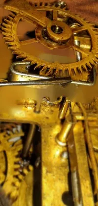 This stunning phone live wallpaper captures a close-up image of the inner workings of an antique clock