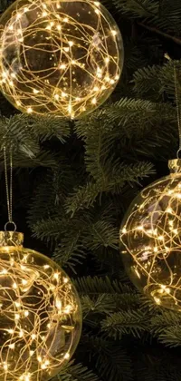 This phone live wallpaper captures the holiday spirit with its close-up view of three intricate ornaments on a Christmas tree