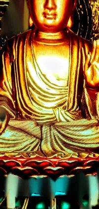 This live phone wallpaper features a stunning golden Buddha statue on a table