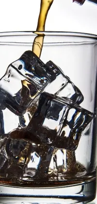 This phone live wallpaper features a high-quality glass brimming with ice cubes, whilst a bottle of wine expertly pours its contents into it