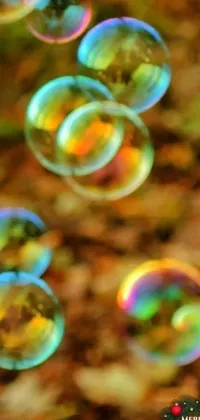 This phone live wallpaper showcases a mesmerizing macro photograph of soap bubbles floating in the air
