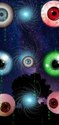 This stunning phone live wallpaper showcases a group of lifelike glass eyeballs set against a mysterious and breathtaking night sky