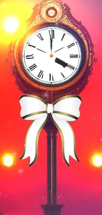 This phone live wallpaper features an art nouveau-inspired clock on top of a pole, with a warm glow emanating from the lights