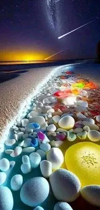 This stunning phone live wallpaper showcases a rainbow of stones on a sandy beach, creating a Tumblr-worthy aesthetic