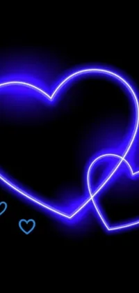 This live phone wallpaper features two blue hearts with a pulsating, shimmering effect