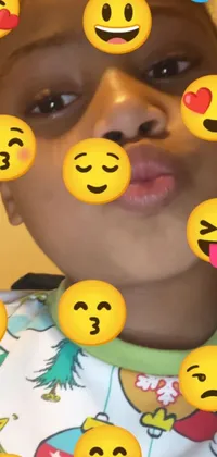 Get ready for a lively and emotive phone experience with this unique live wallpaper! Featuring an adorable African American girl with a varied range of emoticons on her face, this wallpaper is inspired by Instagram and Snapchat story screenshots