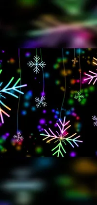 This mobile live wallpaper boasts an alluring digital rendering of a snowflake cluster hanging by strings