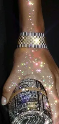 This stunning live wallpaper depicts a close-up of a hand holding a luxurious purse