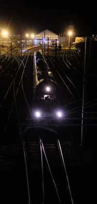 Enjoy the striking view of a train journey at night with this live wallpaper