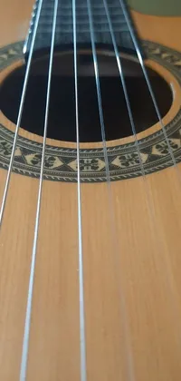 This live wallpaper features a stunningly detailed guitar resting on a wooden table, complete with soft lines, warm colors, and a realistic three-dimensional effect