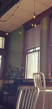 This live wallpaper depicts a cozy room with two chairs facing each other