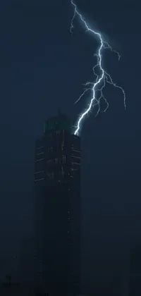 This phone live wallpaper shows a striking lightning bolt hitting a tall building against a modern architectural backdrop