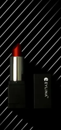This live wallpaper for your phone features a detailed image of a red lipstick resting on a black box