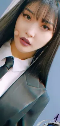 Introducing a stunning live wallpaper for your phone featuring a professional woman wearing a suit and tie with long hair