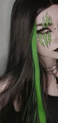This dynamic phone live wallpaper features a captivating close-up of a gothic person with bright green hair