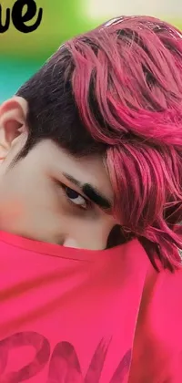This beautiful phone live wallpaper features a captivating digital portrait of a young man with pink hair and a red cloth around his shoulders