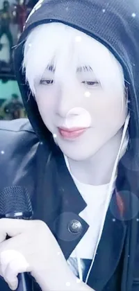 This phone live wallpaper shows a close-up of a microphone being held by a person with flawless white skin