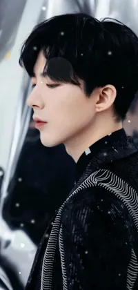 This stunning phone live wallpaper features a close-up of a person wearing a stylish jacket, with shiny white skin and a black short curtain haircut