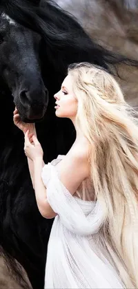 This phone live wallpaper depicts a serene scene of a woman standing beside a majestic black horse