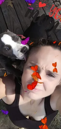 This live wallpaper features a woman taking a selfie with her pitbull dog