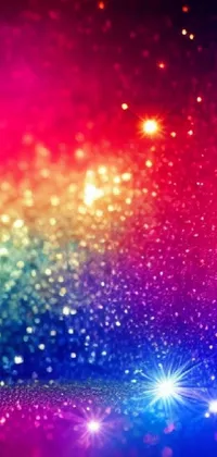 This live phone wallpaper features a beautiful, colorful background with sparkles and stars set against a galaxy of light in a photo studio environment
