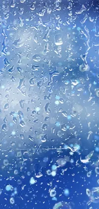 This live phone wallpaper features a close-up of water droplets on a window, with a blue light dark blue sky backdrop