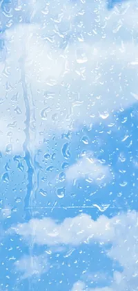 Elevate your digital experience with our phone live wallpaper featuring a mesmerizing scene of raindrops cascading down a windowpane