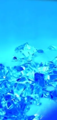 This phone live wallpaper features a stunning pile of ice with a crystal-like structure, rendered in exquisite detail