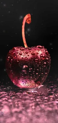 Enhance your mobile display with this engaging live wallpaper showcasing a tempting red apple adorned with water droplets