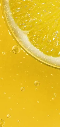 This phone live wallpaper features a stunningly close-up slice of lemon set against a bubbly, liquid simulation background, creating a captivating scenery