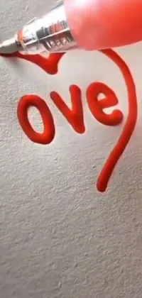 Looking for a unique and heartwarming phone live wallpaper? Look no further than this creative design featuring the word "love" written on a piece of paper