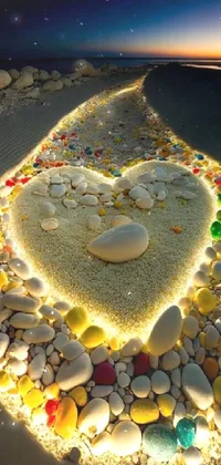 This live phone wallpaper showcases a captivating heart of rocks arranged perfectly in a beach mosaic